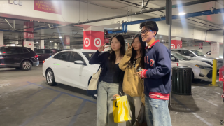 Eric Ou poses with fans at USC Village.